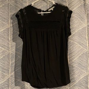 Adorable black shirt with lace detail on sleeve
